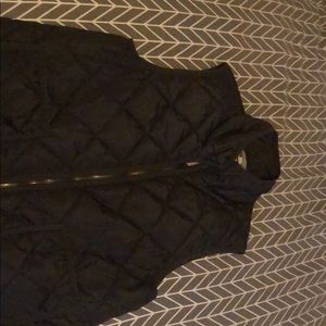 Olive green vest with tan lining.